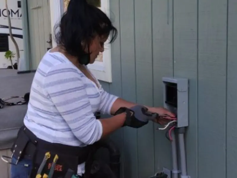Licensed electrician wiring an exterior subpanel in Rancho Murieta