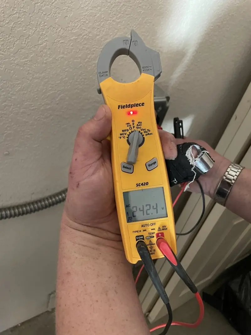 Voltage testing with clamp meter during Outlet Installation in Rancho Murieta